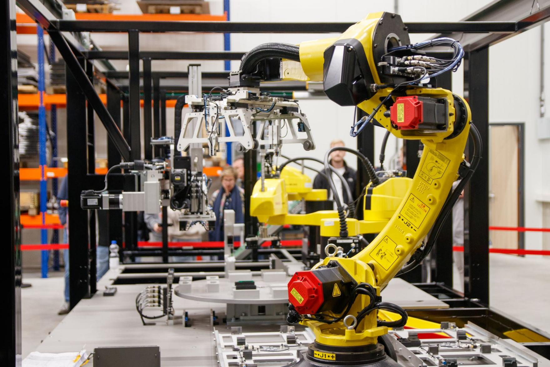 An industrial robot arm working on a manufacturing line